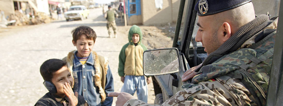 Friendly face: a NATO ISAF soldier greets civilians in Mazar-e Sharif, Afghanistan. Image: Agencja Fotograficzna Caro / Alamy