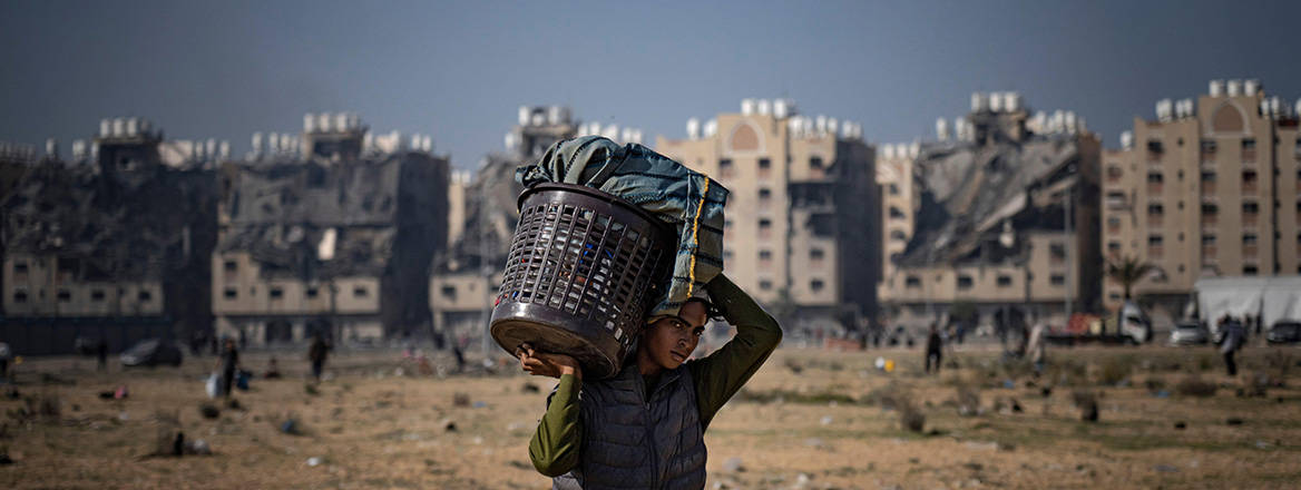 Seeking safety: a Palestinian civilian flees from the east side of Khan Younis in the Gaza Strip during the ongoing Israeli bombardment