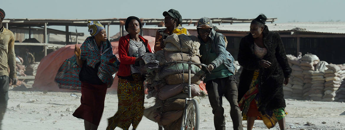 Prized goods: workers transport bags of cobalt ore in the Democratic Republic of Congo