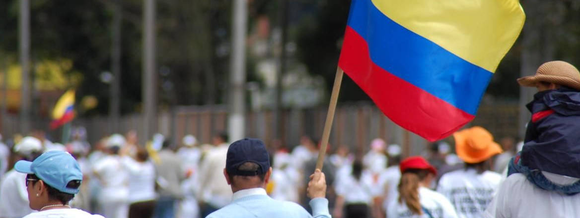 person holding Colombia flag