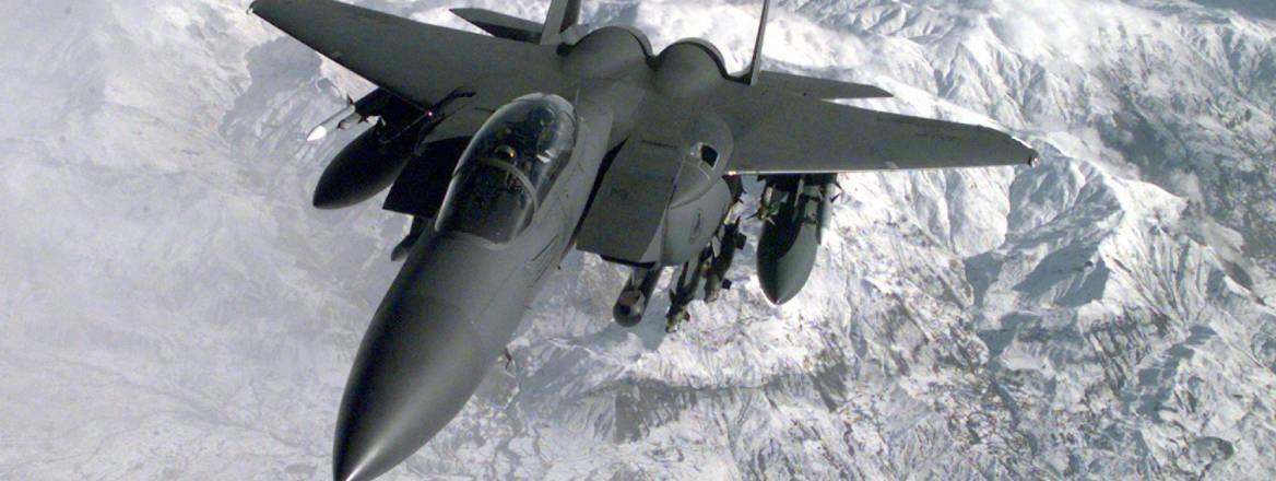 A US Air Force F-15 approaches the refueling boom of a tanker aircraft