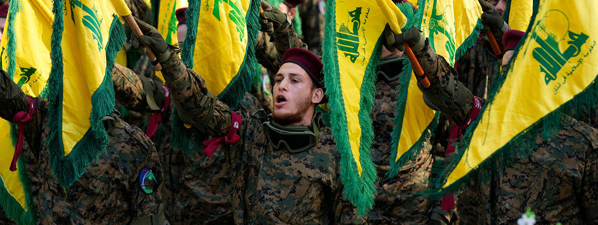 Tensions run high: Hizbullah fighters attend the funeral of one of their commanders who was killed in an Israeli strike in January 2024