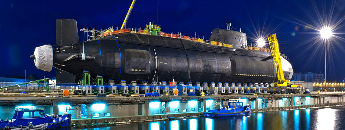 Astute-class nuclear submarine HMS Artful, built by BAE Systems, is lowered into the water at Barrow-in-Furness in 2014