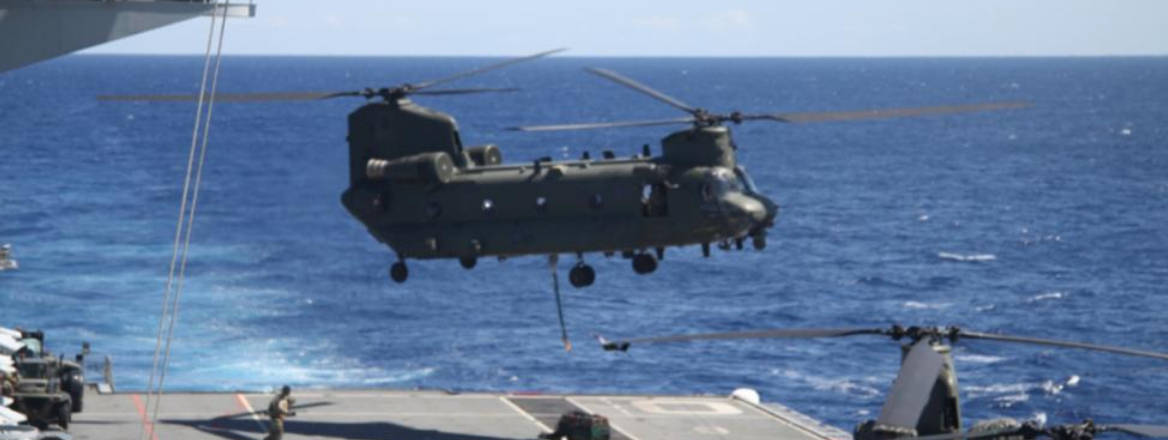 RAF Chinooks load supplies on HMS Ocean