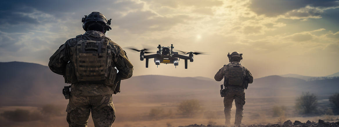 two soldiers launch a full-sized military combat drone into flight