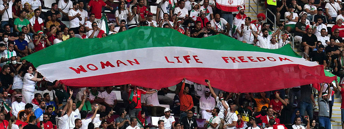 Rallying cry: Iranian fans hold up an anti-regime protest banner during the FIFA World Cup in Qatar in November 2022