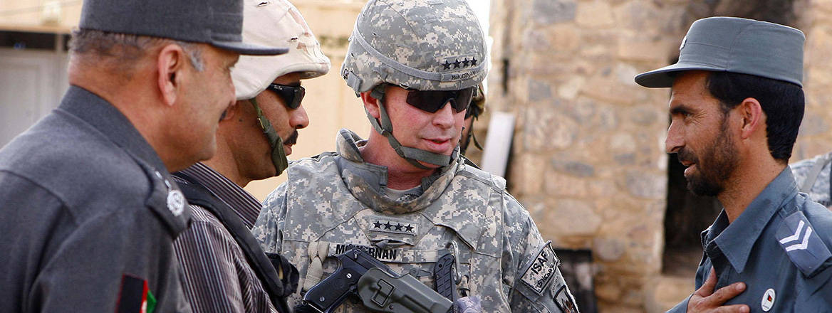 International Security Assistance Force commander General David McKiernan visits national policemen in Afghanistan in 2009