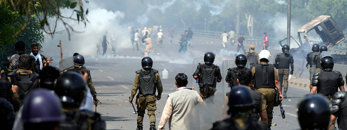 Tensions run high: police fire tear gas to disperse supporters of Pakistan's former Prime Minister Imran Khan during protests in Lahore on 9 May 2023