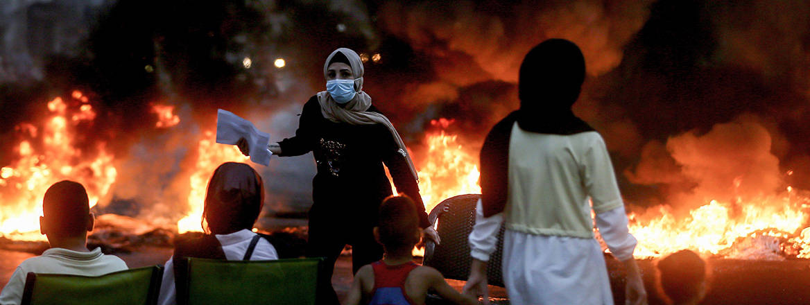 Grievances flare: relatives of individuals detained during violent clashes the year before protest in Beirut in October 2022