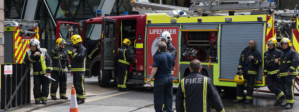 Under scrutiny: London Fire Brigade crews attend an emergency incident in the City of London