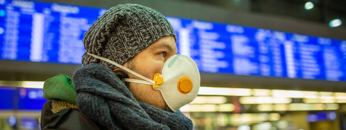 man with mask in airport