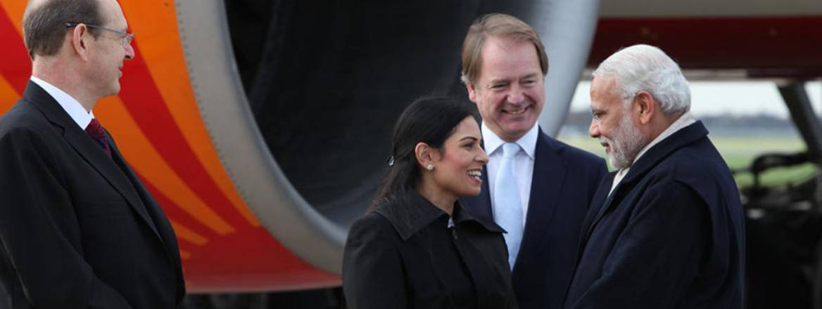 Narendra Modi is greeted by Priti Patel