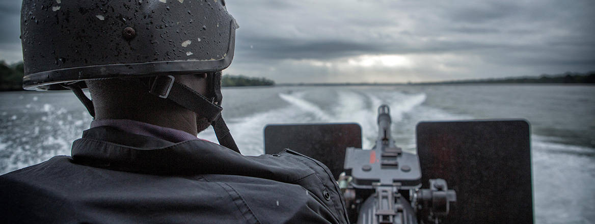 Keeping watch: a Nigerian Navy vessel patrols the rivers and creeks of southern Nigeria for illegal refineries and oil runners