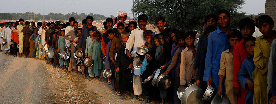 Victims of inaction: Pakistanis gather to receive aid following floods in September 2022