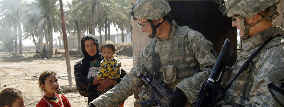 US soldiers hand out leaflets in the village of Bini Ziad