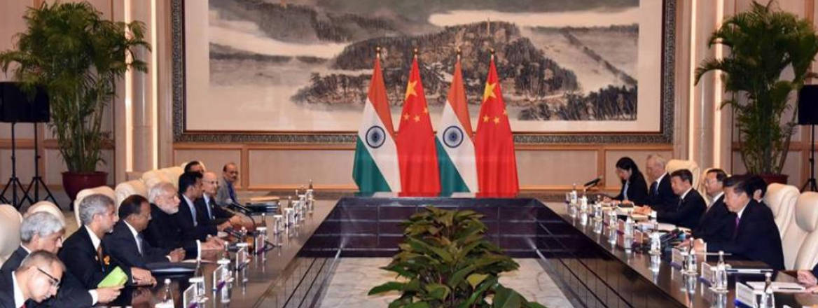 Prime minister Narendra Modiand President XI Jinping discussing