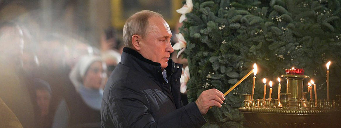 Praying for good news: Russian President Vladimir Putin attends a ceremony for Orthodox Christmas