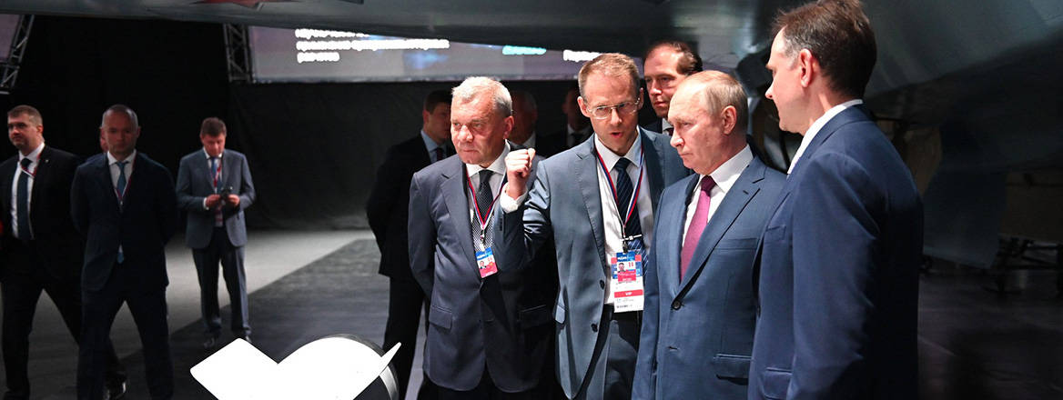 Made in Russia: Vladimir Putin inspects a fighter aircraft with ministers Yuri Borisov (left) and Denis Manturov (behind)