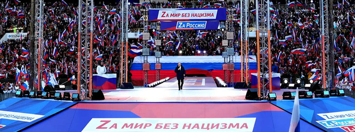 Russian President Vladimir Putin gives a speech at the Luzhniki Sports Centre in Moscow on 18 March. Courtesy of kremlin.ru / Wikimedia Commons / CC BY 4.0