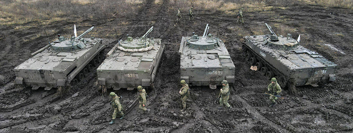 Russian infantry and BMP-3 vehicles pictured during exercises held in Russia's Rostov region on 10 December 2021. Courtesy of Reuters / Alamy Stock Photo