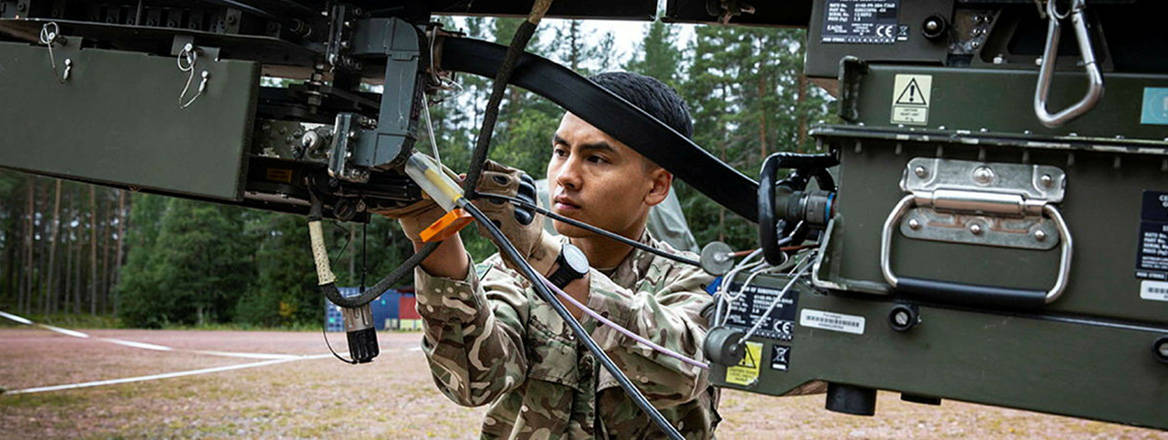 All joined up: a signaller checks the satellite connection back to the UK during JEF Exercise JOINT PROTECTOR 21