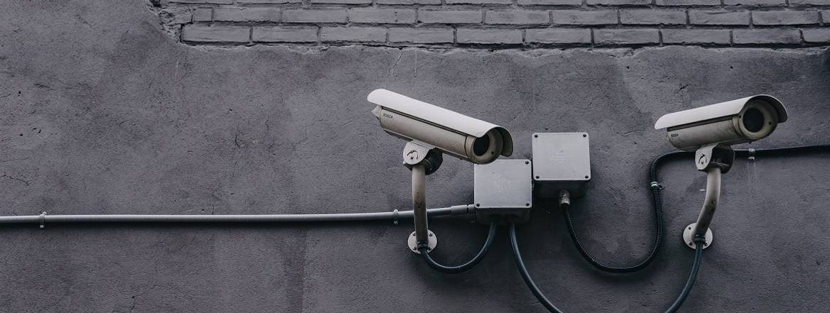 cctv camera on a grey wall