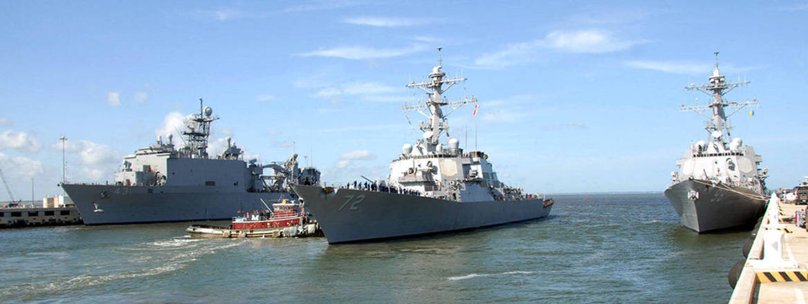 US Navy vessels leaving port ahead of Hurricane Irene, 2011. Courtesy of Rafael Martie / US Navy / UPI