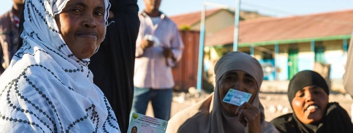 Women in Somaliland holding their Voter ID cards
