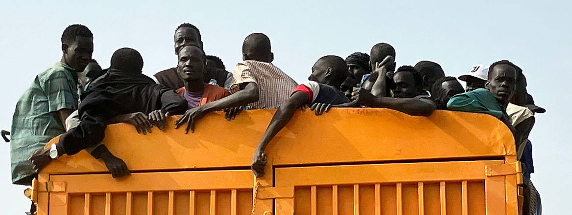 Seeking safety: refugees from Sudan travel by truck across neighbouring South Sudan