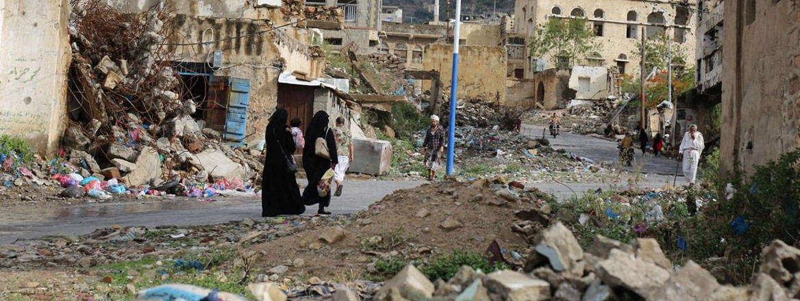 Yemenis walking through the rubble of houses destroyed by the war in Yemen, Taiz, 29 April 2021