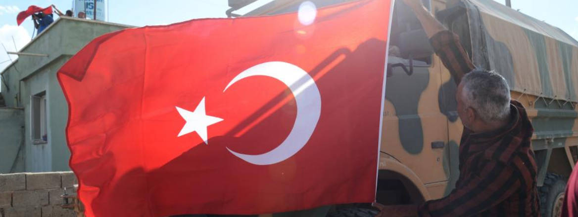 Turkish flag over truck as a welcome