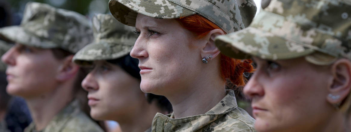 Reporting for duty: female servicemembers belonging to Ukraine's 16 Army Aviation Brigade stand to attention