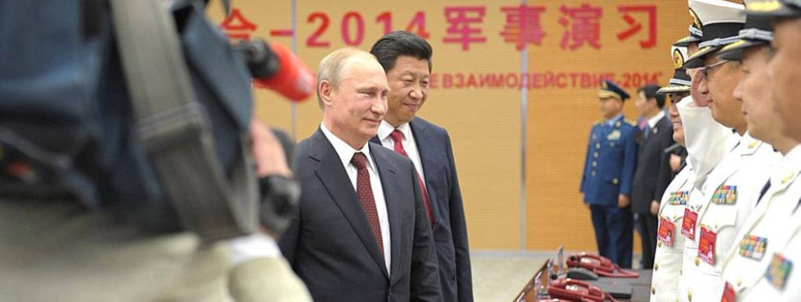 Putin and Xi Jinping before a joint naval exercise