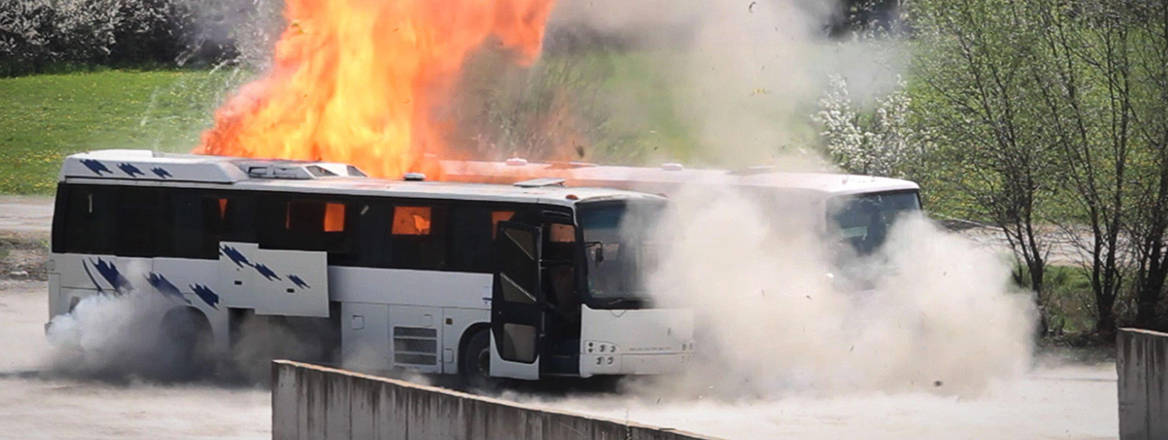 Bulgarian investigators stage a re-enactment of the bus bombing that killed five Israeli tourists, the bus driver and the alleged perpetrator at the Burgas airport in July. 2012 