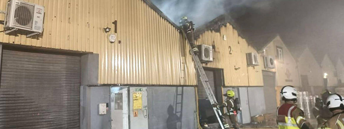 Industrial units ablaze, after Wagner Group stooges – later jailed – set fire to a warehouse.