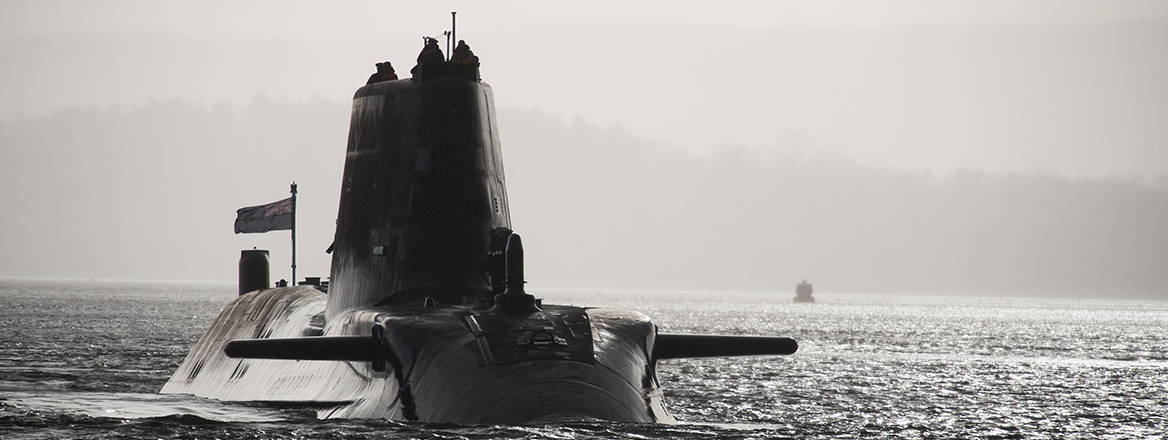 Royal Navy submarine HMS Astute sails up the Clyde estuary into her home port of Faslane, Scotland.