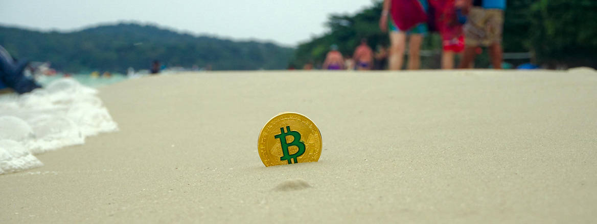 A token representing a Bitcoin washing up on the shore.