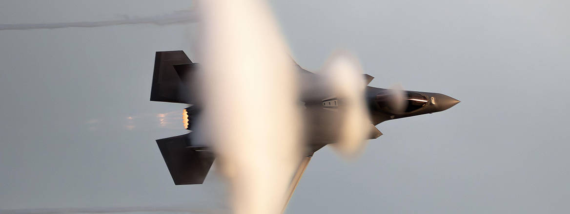 US Air Force F-35 Lightning II from the 495th Fighter Squadron (RAF Lakenheath) in flight generating vapor cones.