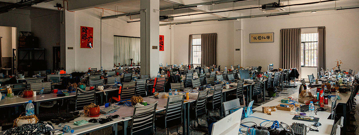 A room full of abandoned work stations and belongings at the O'Smach scam centre compound in Samraong, Cambodia.