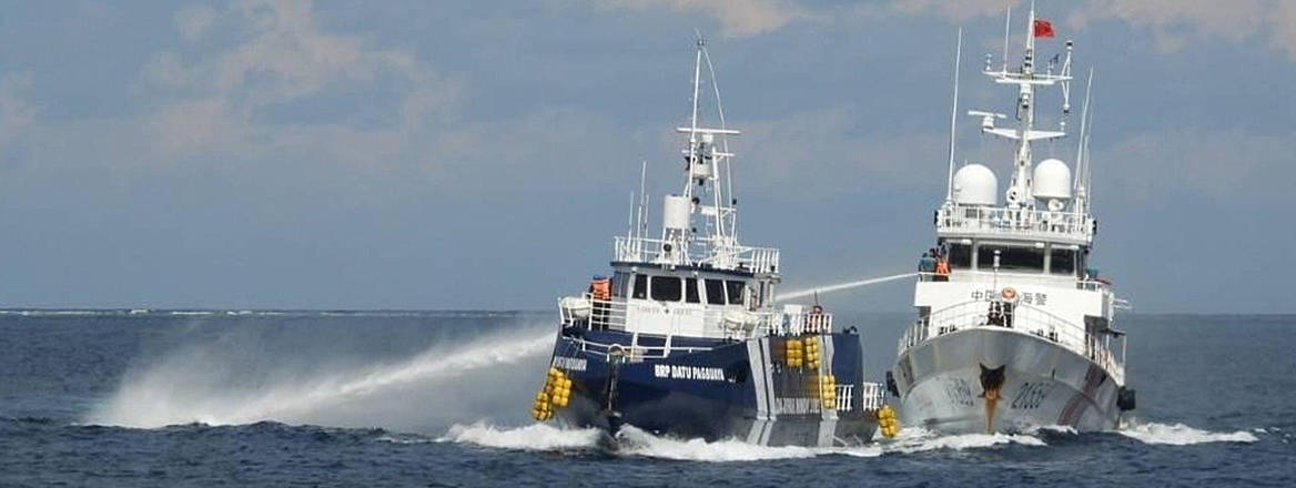 A Chinese Coast Guard vessel fires its water cannon at the Philippine's BRP Datu Pagbuaya near Philippine occupied Thitu island, locally called Pag-asa island, on 12 October 2025.