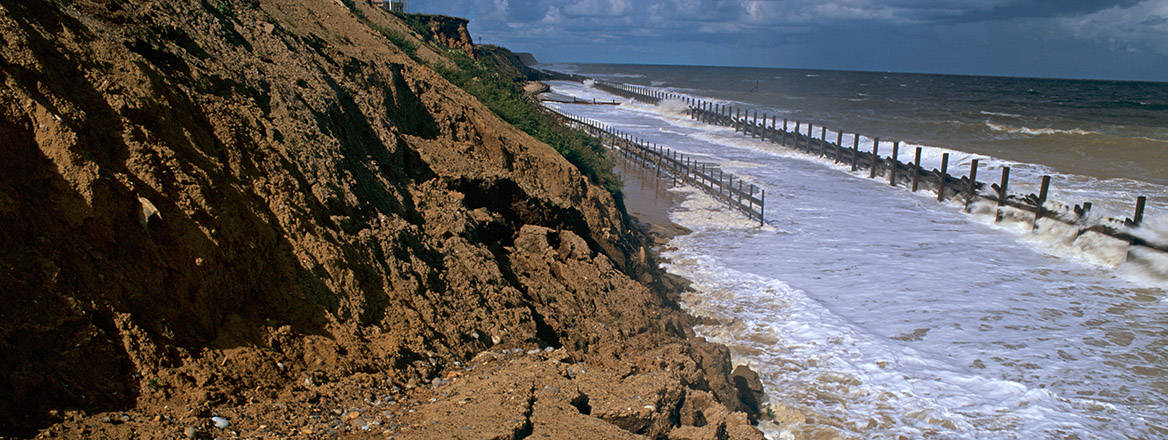 Rising sea levels causing coastal erosion at Happisburgh, Norfolk, UK.