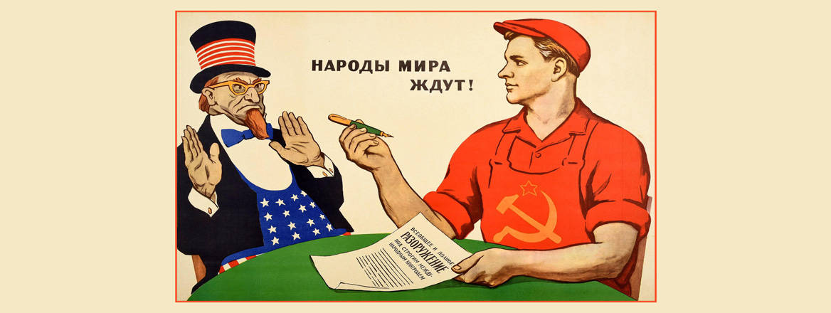 A Soviet propaganda poster titled: ‘The People of the World are Waiting’, with a Soviet worker asking Uncle Sam to sign a Cold War agreement which reads ‘Universal and Complete Disarmament Under International Control’. Courtesy of Shawshots / Alamy