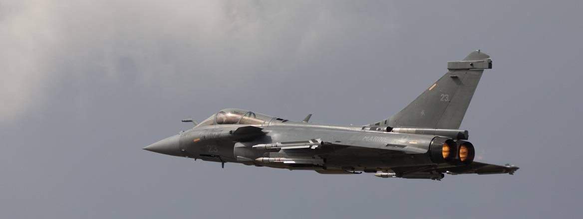 A Dassault Rafale fighter aircraft flies through the sky