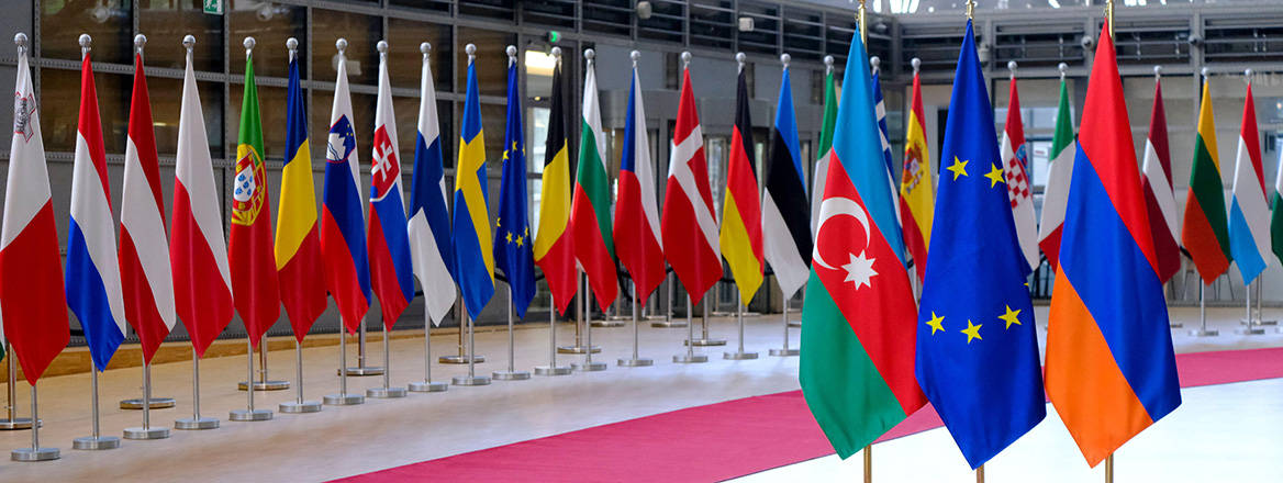 Aligning interests: Flags of Azerbaijan, Europe and Armenia in EU Council building in Brussels, Belgium. Image: Alexandros Michailidis / Alamy