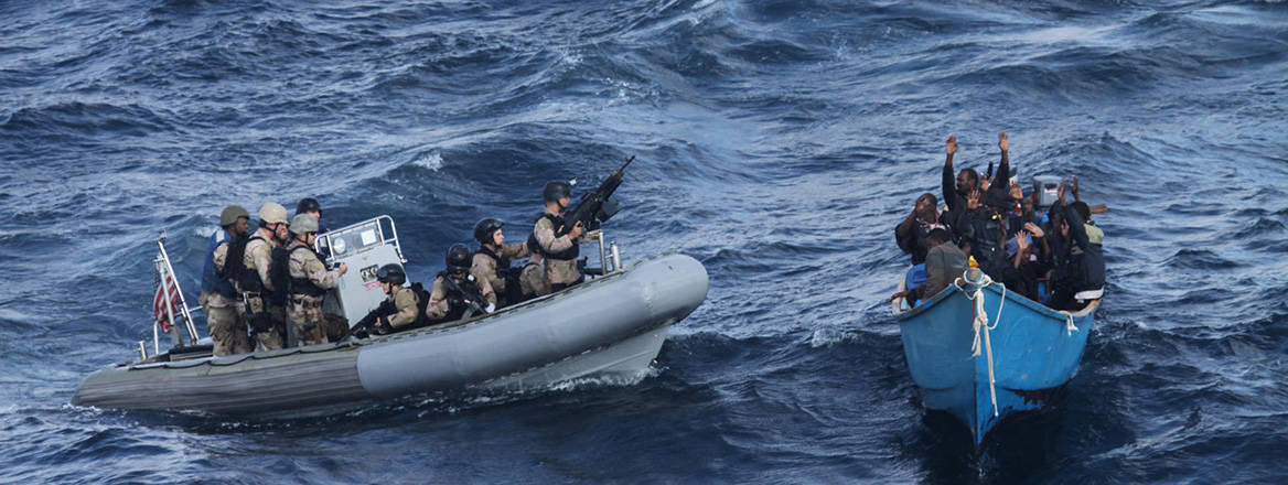 A visit, board, search, and seizure team from USS Pinckney approaches a suspected pirate vessel following an attack on the Nordic Apollo vessel in the Gulf of Aden.