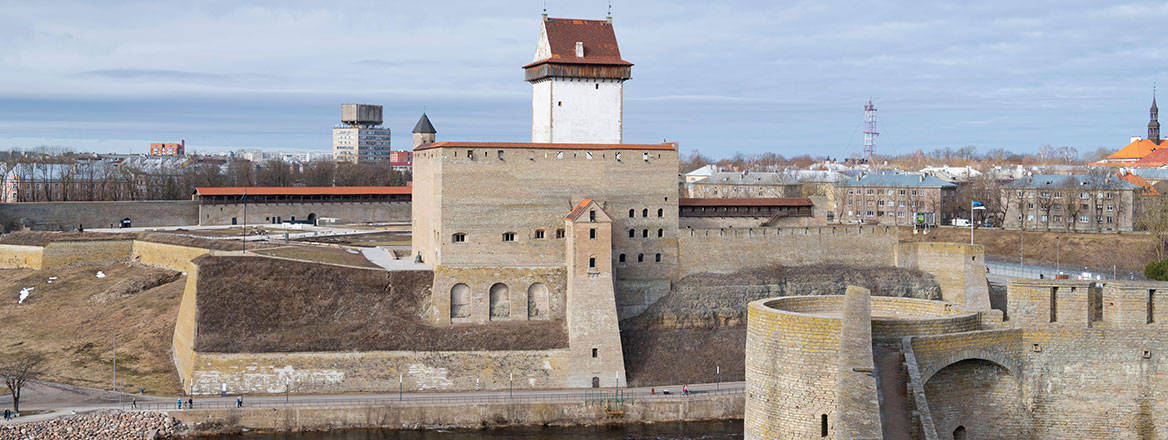 View of the ancient Herman castle from the wall of the Ivangorod fortress. It is located on the Narva River along the Russian border with Estonia. Courtesy of Viktor Karasev / Alamy