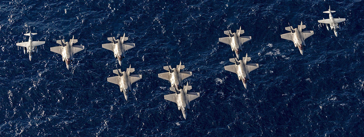 Italian and British F-35B Jets and Italian Navy AV-8B Harrier II Jets involved in Operation Highmast fly together.
