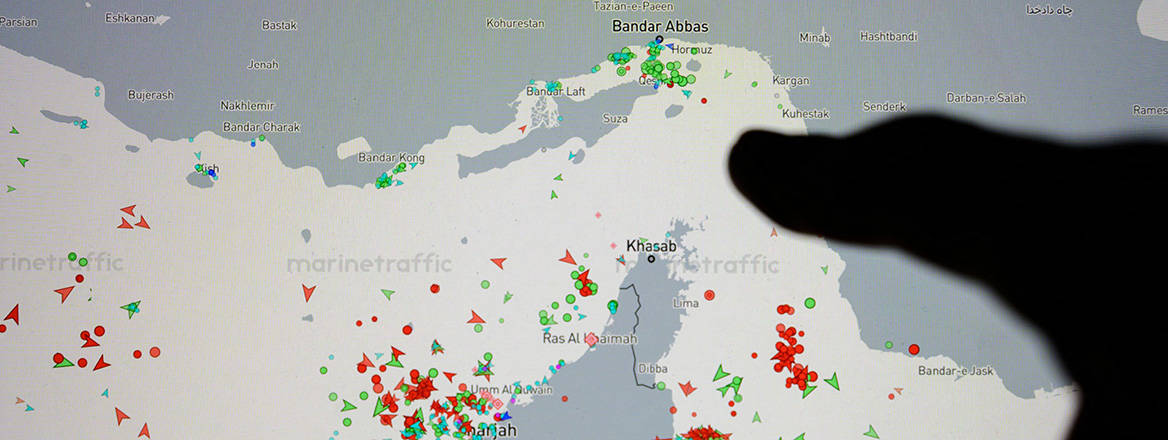A finger points to the Strait of Hormuz on a Marine Traffic digital map during the US war with Iran.