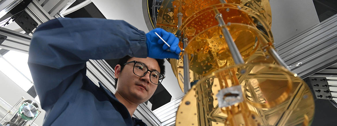 Technicians assembling parts for an ultra-low temperature dilution refrigerator for quantum computing in the manufacturing workshop of Hefei Zhileng Cryogenic Technology, on April 21, 2025.
