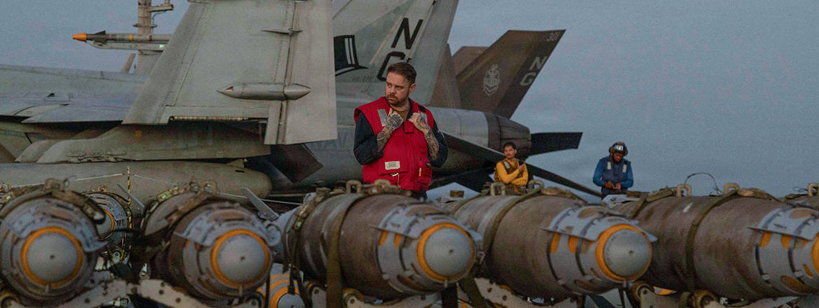 US Navy sailors transfer ordnance from an aircraft elevator during operations on the flight deck of the Nimitz-class aircraft carrier USS Abraham Lincoln during Operation Epic Fury.